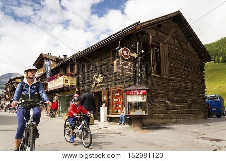 Livigno, Italy - August 1: Tourists Shopping On The Streets Of Duty-free Area On 1 August 2016 In Li
