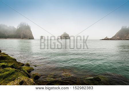 small islands in the fog off the Washington coast on the La Push Native American Reservation USA