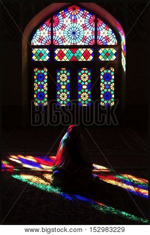 Iran Shiraz - September 2016: Persian girl in multi-colored mosque Nasir ol Mulk