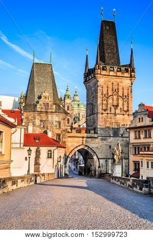 Prague Czech Republic. Charles Bridge with its statuette Lesser Town Bridge Tower and the tower of the Judith Bridge.