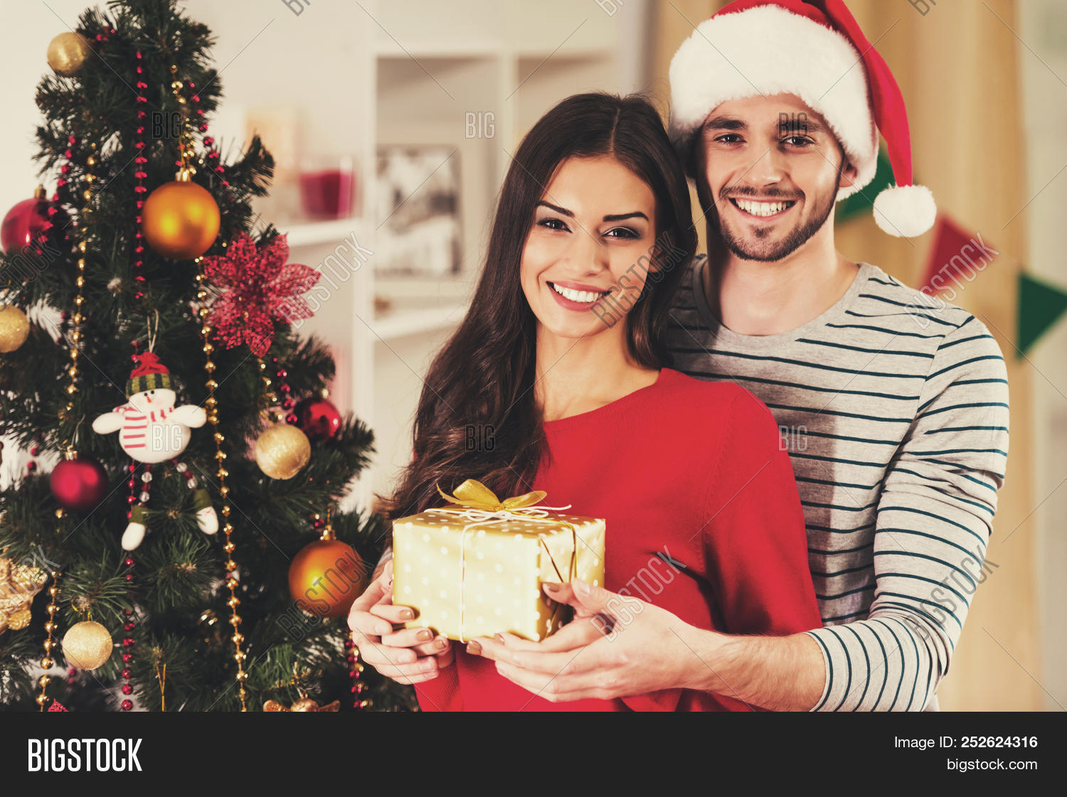 young couple holding image