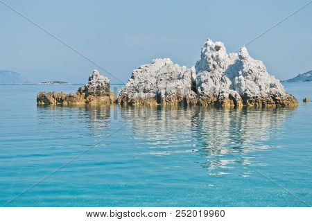 Sea Rocks At Calm And Crystal Clear Turquoise Water At Morning, Milia Beach, Island Of Skopelos, Gre
