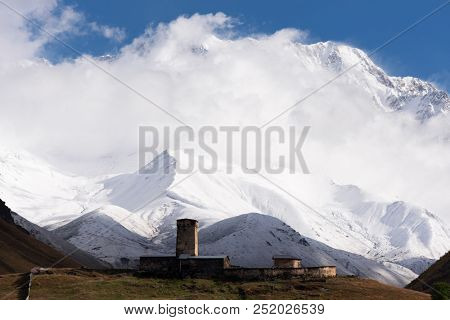 View of Mount Shhara. Ushguli community, church of Lamaria in a mountain valley. Zemo Svaneti, Georgia