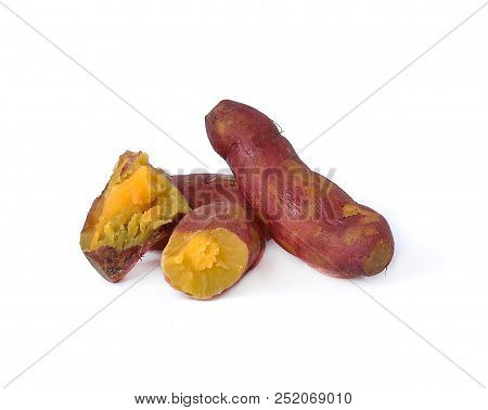 Whole Purple Yams Photographed On A White Background.