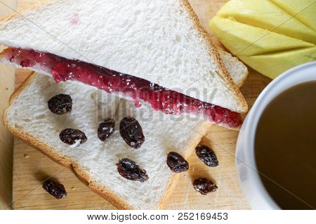 Morning Breakfast Have Blueberry Jam And Currants On Brown Bread With Mango And Coffee . It Is Healt