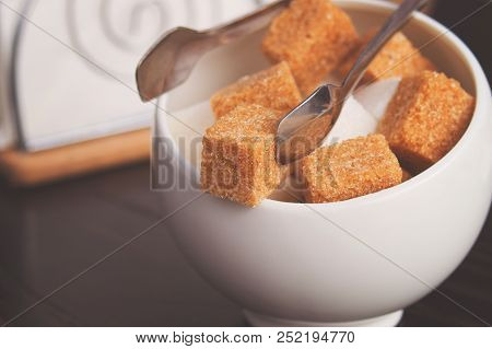 Sugar Bowl With Cubes Of White Cane Sugar, Sugar-tongs And Napkins. Atmosphere And Table Appointment