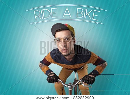 Kooky young guy on a bike with cyclist keywording and streaky background