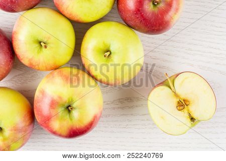 Lot Of Whole One Slice Of Fresh Red Apple James Grieve Variety Flatlay On Grey Wood