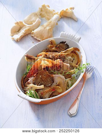 Pork Steaks With Oyster Mushroom And Crispy Bacon Casserole.