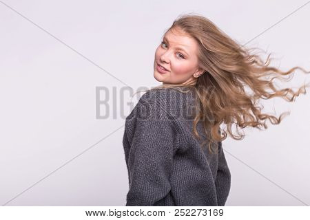 Portrait Of Beautiful Young European Woman With Blond Flatterig Hair.