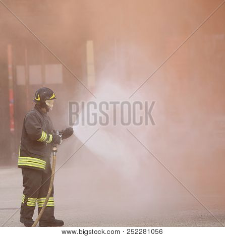 Italia, It, Italy - May 10, 2018: Italian Firefighter Uses The Hydrant With Foam During A Practice F