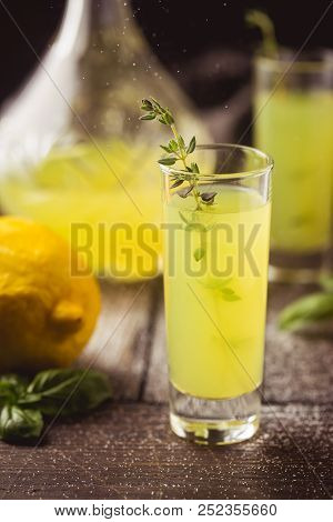 Traditional Italian Lemon Liqueur Limoncello And Fresh Citrus Lemon. Alcoholic Beverage.
