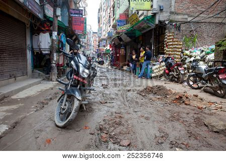 KATHMANDU, NEPAL - JULY 17, 2018: Street in the Thamel district, Kathmandu. Thamel is a tourist district with many hotels, souvenir shops, restaurants and nightlife