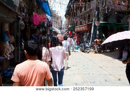 KATHMANDU, NEPAL - JULY 17, 2018: Street in the Thamel district, Kathmandu. Thamel is a tourist district with many hotels, souvenir shops, restaurants and nightlife