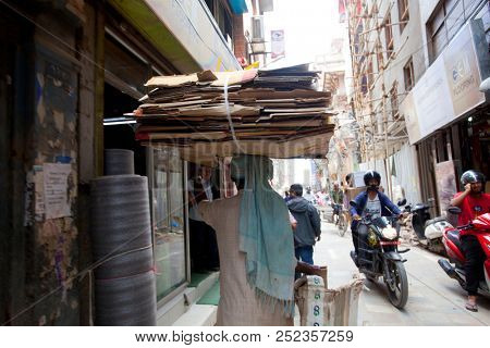 KATHMANDU, NEPAL - JULY 17, 2018: Street in the Thamel district, Kathmandu. Thamel is a tourist district with many hotels, souvenir shops, restaurants and nightlife