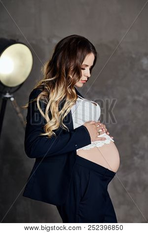 Fashion Portrait Pregnant Woman Blonde, Perfect Figure Of Girl. Woman Is Waiting For The Birth Of A