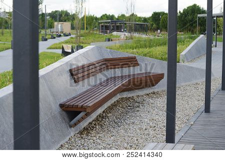 Wooden Concrete Bench In The Park.