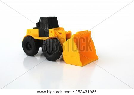 Isolated Toy Loader With White Background In Yellow And Black Colors