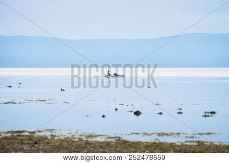 Fisherboat In The Endless Blue White Ocean Of Siquijor With Mountain, Philippines, Asia