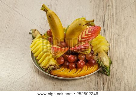 Very Nice And Artistically Sliced Fruits On A Platter.