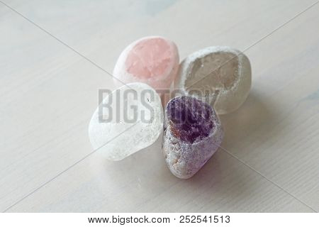 Pink Quartz, Amethyst, Rock Crystal, Smoky Quartz. Collection Of Natural Stones Of Minerals On A Bac