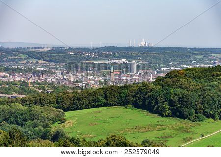 Cityscape Of Aachen With Historic Cathedral And Town Hall And Surrounding Landscape Taken From Above