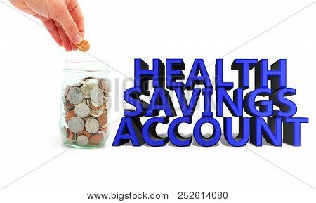 Hand Putting Penny In A Coin Jar Next To Health Savings Account 3d Text