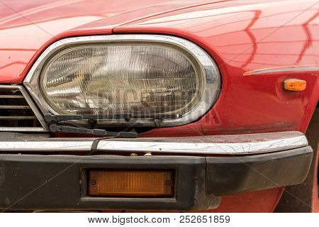 Vintage Car Headlight. Retro Headlamp With Wiper Blade On Classic Vehicle. Old Red Automobile  Head 