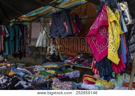 Dumaguete, The Philippines - 27 July 2018: Cheap Colorful Clothes On Local Market Store. Second Hand