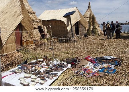 Landscape Of The Uros Floating Islands In The Magic Blue Colors Of The Titicaca Lake With The Andes 