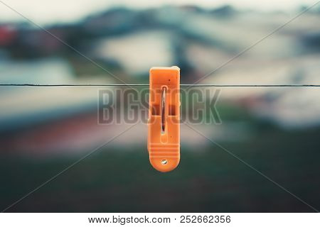 Alone Plastic Clothes Peg. Royalty High Quality Stock Photo Of A Yellow Plastic Clothes Peg Clothesp