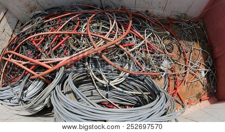 Large Containers With Many Large Old High Voltage Cables In The Landfill Of Recyclable Material In T