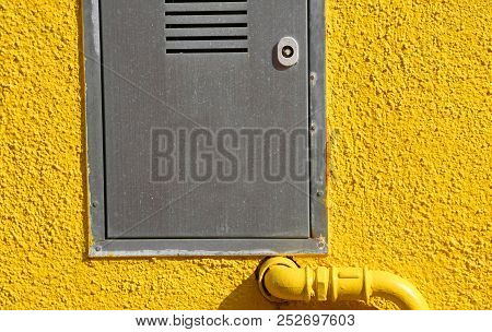 Cassette For Meters With A Yellow Tube And Wall