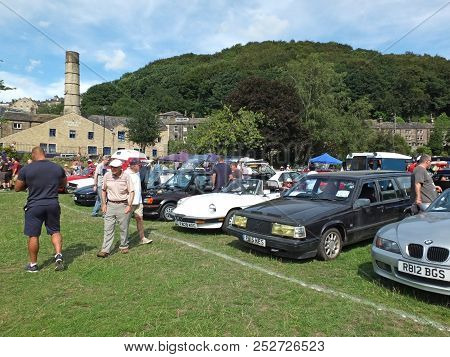 Hebden Bridge, West Yorkshire, England - August 4 2018: People Looking At Rows Of Vintage Cars At He