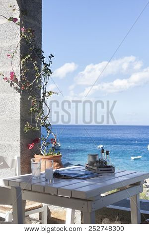 Greek Restaurant, Food Taverna And Caffe, Above The Beach In Summer