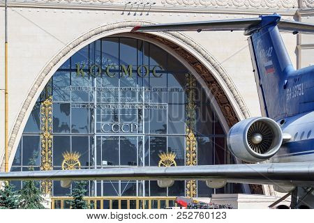 Moscow, Russia - August 01, 2018: Glass Facade Of Pavilion Space Against Legendary Soviet Airliner Y