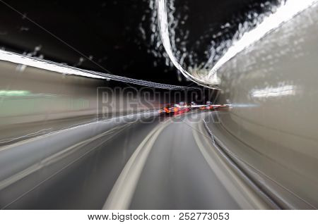 Turn The Mountain Tunnel, Shot Through The Wet Window Of The Bus. Long Exposure.