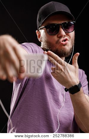 The Man Listening To Music In Headphones