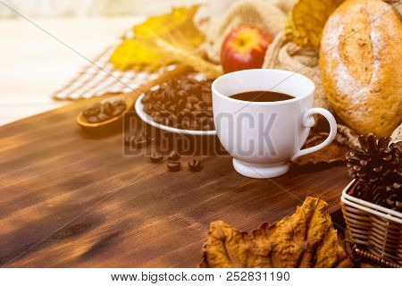 Cup Of Hot Coffee With Toast For Autumn Season Warm Drink. Fall Harvest Cornucopia. Copy Space On Wo