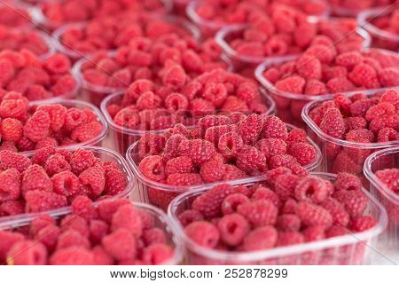 Assortement Of Organic Berries In Boxes At Market. Raspeberries, Blackberries And Raspberries.