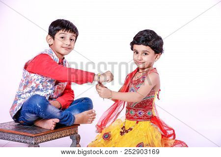 Cute Indian Child Brother And Sister Celebrating Raksha Bandhan Festival