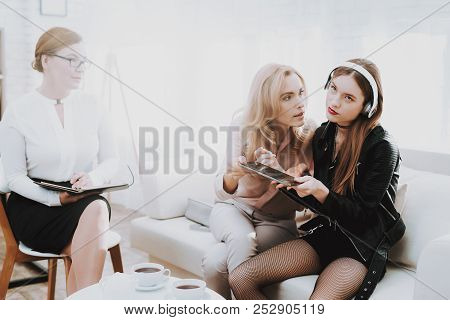 Girl In Jacket Listens To Music In Psychologist Office. Punk In Lather Jacket. Puberty Problems. Con