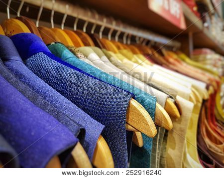Multi Color Dress Sherwani Kurta Hanging From Hangar In A Garment Shop For Sale