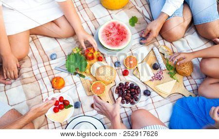 Summer Picnic Basket On The Green Grass. Food And Drink Concept. Friends Party Time