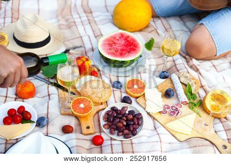 Summer Picnic Basket On The Green Grass. Food And Drink Concept. Friends Party Time