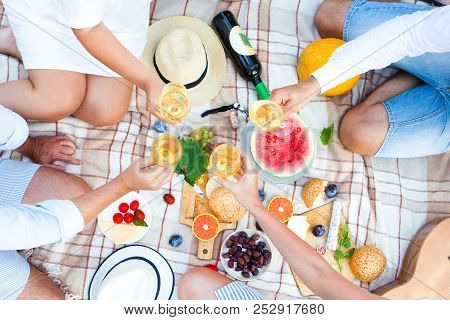 Summer Picnic Basket On The Green Grass. Food And Drink Concept. Friends Party Time