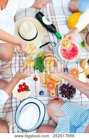 Summer Picnic Basket On The Green Grass. Food And Drink Concept. Friends Party Time