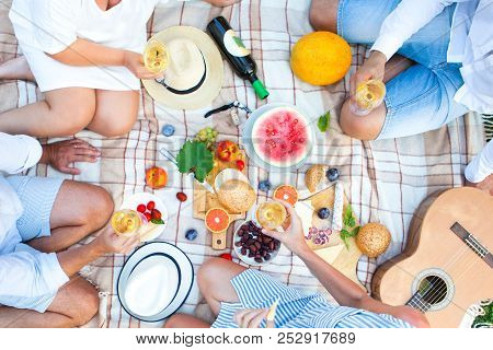 Summer Picnic Basket On The Green Grass. Food And Drink Concept. Friends Party Time