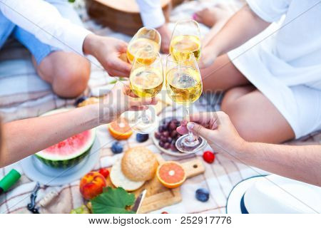 Summer Picnic Basket On The Green Grass. Food And Drink Concept. Friends Party Time