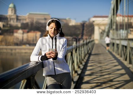 Young Athlete Woman With Mobile Phone Outdoor